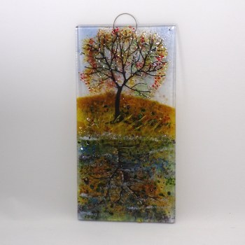 Glass Wall Hanging showing a tree with autumnal leaves reflected in the canal.