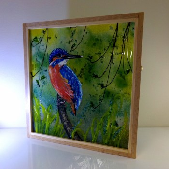 Fused glass picture of kingfisher perched on a branch near the canal. Picture framed in oak.