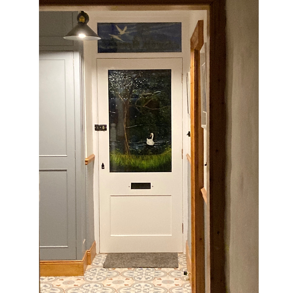 Door panels installed in the customers' home. The background of the sky and canal is subdued, but the swans are highlighted.