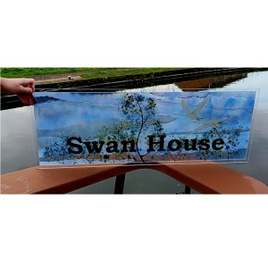 Top door panel with the house name 'Swan House' and 2 swans in flight.