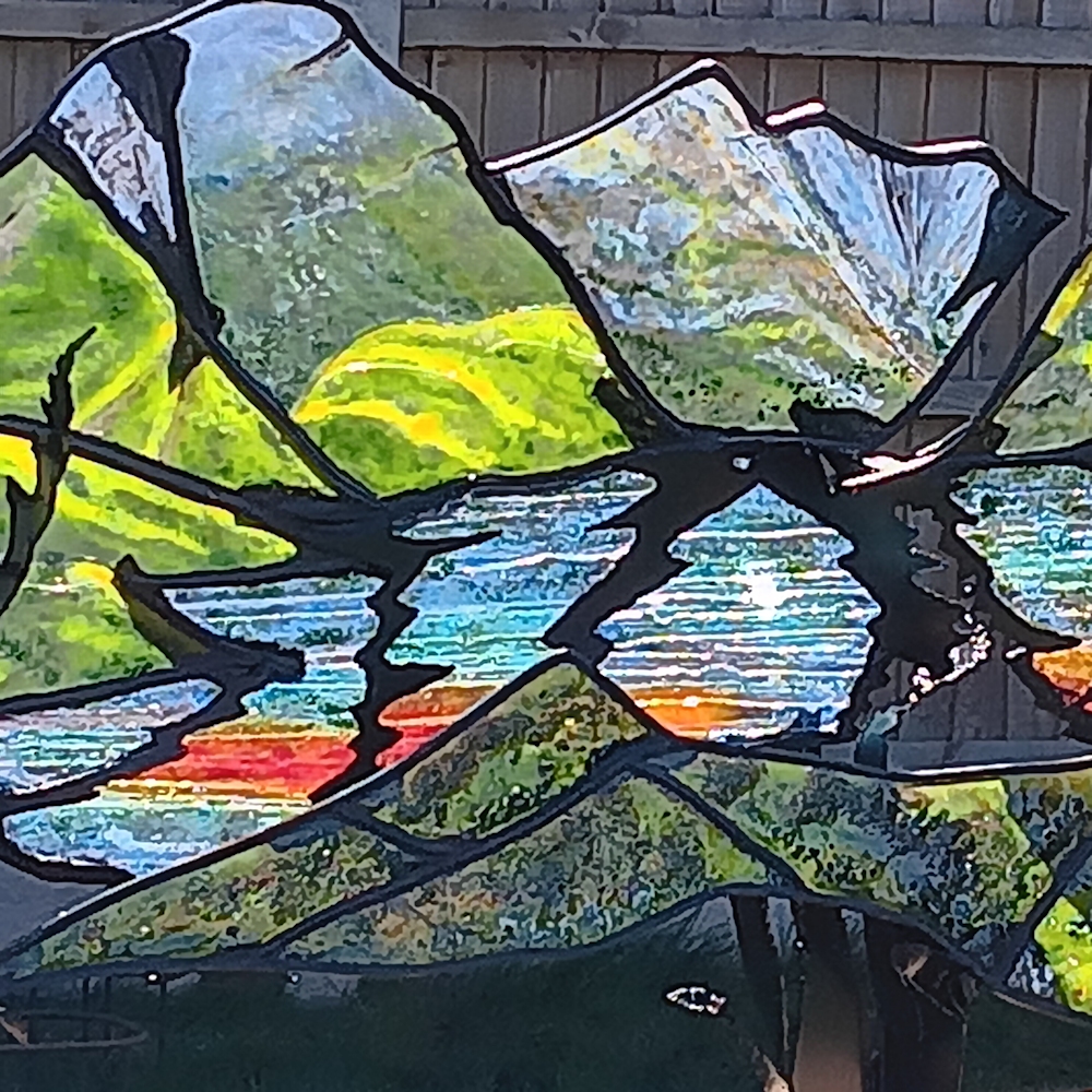 Garden Sculpture 'Kyles of Bute'. Black metal frame with coloured glass outlining the view of the loch.