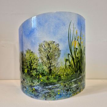 Fused curved fused glass sculpture. Canal is featured with yellow Flag Iris on the bank.